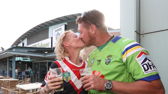 Mixed-allegiance couple Sammy Adams and Luke Burns are watching the game at the Belconnen live site. Picture: Gary Ramage