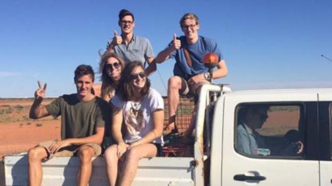 Australian swimmers Mitch Larkin (back left), Mack Horton (back right), Emily Seebohm (middle), Cameron McEvoy (front left) and Cate Campbell (front right) ride in the back of a ute in Central Australia last week. Source: Instagram