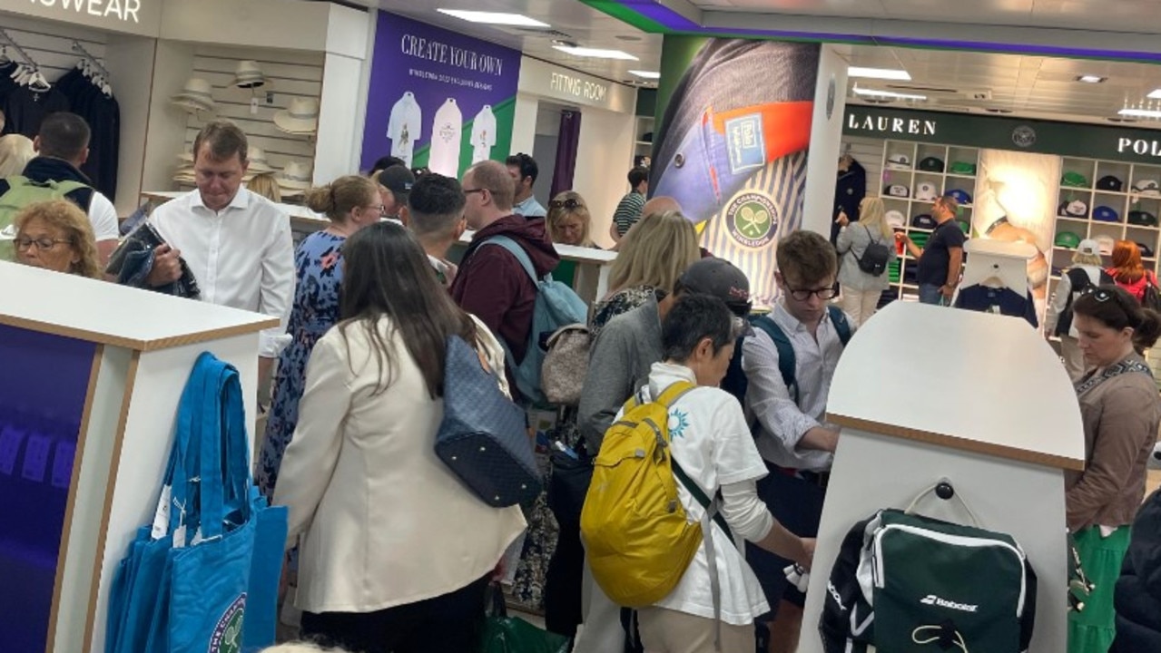 Fans enjoy the, ahem, intimate experience of shopping at Wimbledon. Picture: news.com.au