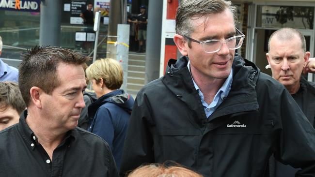 Premier Dominic Perrottet and Deputy Premier Paul Toole assessing the flood wrecked Lismore CBD last April.