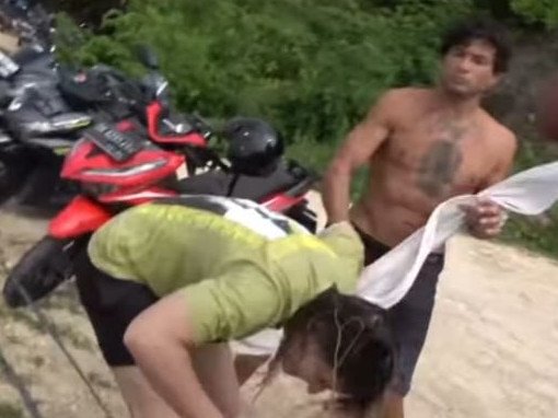 An American surfer has shared shocking footage of her being punched by a man Bali.