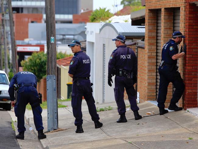 Police scour the street for evidence this morning. Picture: Dylan Robinson