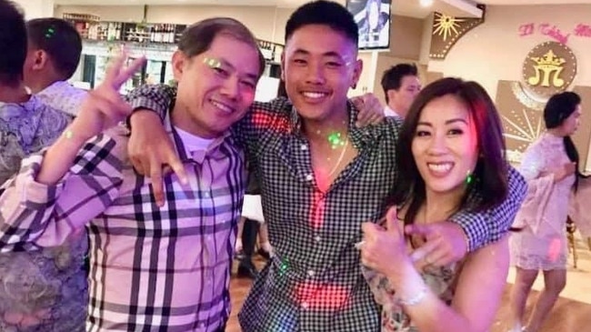 Thomas Tran with his parents.