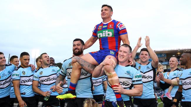 Heighington is chaired off the field by former Sharks teammates. (Cameron Spencer/Getty Images)