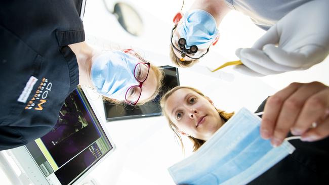 Dentist Stephen Dilger with nurses Tash Briggs and Caitlin Wilde at Dental On Macquarie. Picture: RICHARD JUPE