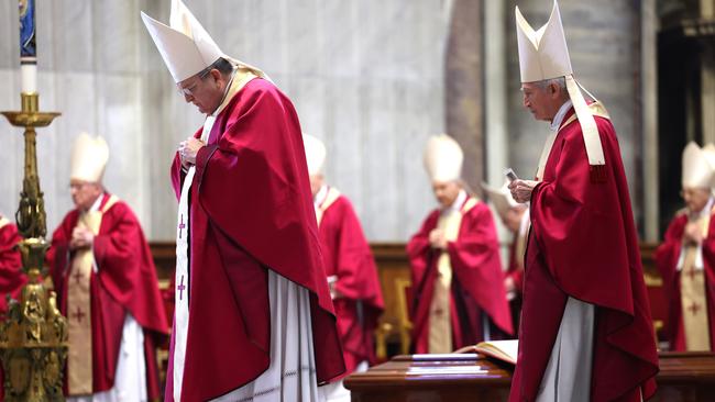 Cardinals pray by the coffin of Cardinal Pell during his funeral mass at Altar of the Chair of St. Peter Basilica. Picture: Getty Images