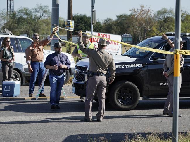 Law enforcement officers man a barricade near the First Baptist Church. Picture: AP