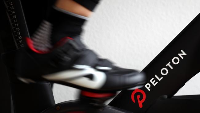 Peloton has lowered its revenue forecasts several quarters in a row, and has said it would cut roughly 20 per cent of its corporate positions to help cope with widening losses as demand cools. Picture: AFP