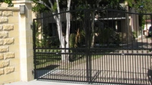 Three young men jumped the 2m fence to escape when the woman’s husband arrived home. Photo: Contributed