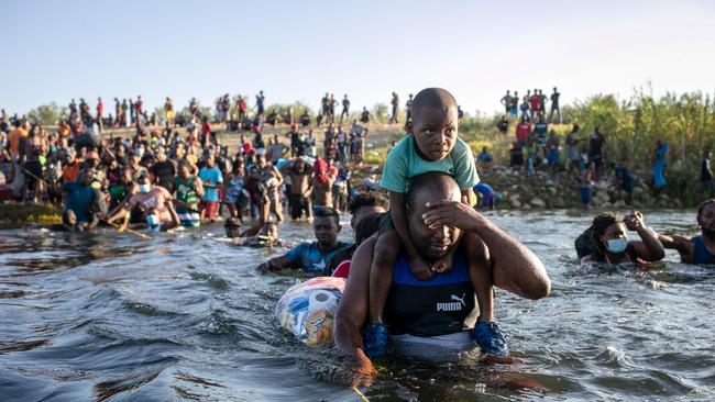 Haitian immigrants cross the Rio Grande back into Mexico from Del Rio, Texas in September 2021. Picture: John Moore/Getty Images