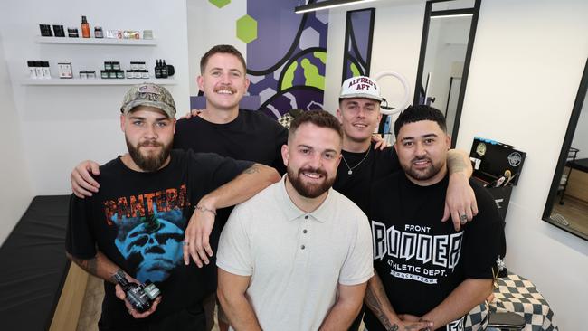 Backbone Barbershop in Currumbin has won the Bulletin's best barber on the Gold Coast competition. Owner Sam Squires (white top) and crew happy about the win. Picture Glenn Hampson