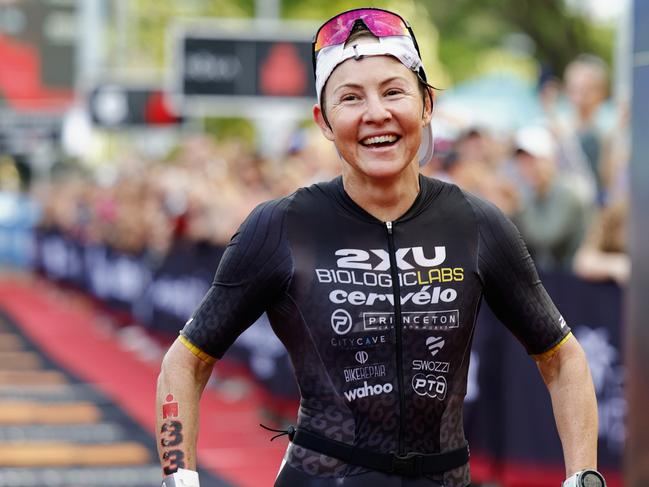 Kylie Simpson crosses the finish line on the Cairns Esplanade to win the Ironman Cairns Asia Pacific Championship race. Picture: Brendan Radke