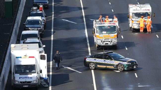 Police and emergency crews at the scene of the EastLink shooting. Picture: David Crosling