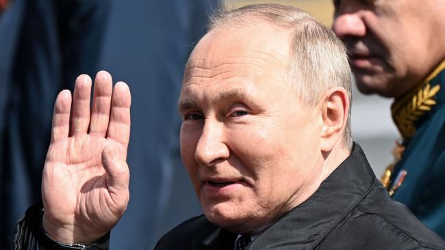 Russian President Vladimir Putin leaves Red Square after the Victory Day military parade in central Moscow.