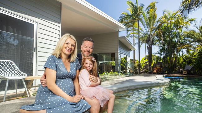 Kate Lawton, husband Karel Chaloupka and daughter Ruby who moved from Victoria and bought a house at Sunrise Beach. Photo Lachie Millard