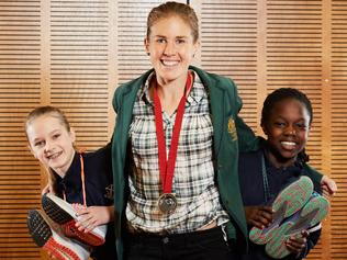 23/6/16 Cross country runners Elizabeth, 12 with Olympic marathon runner Jess Trengove and Lola, 10 at St Andrews School in Walkerville. Picture: MATT LOXTON