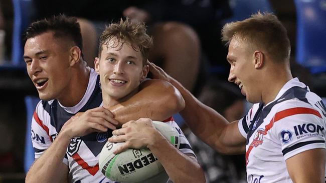 NEWCASTLE, AUSTRALIA - MAY 01: Sam Walker of the Rooster celebrates his try with team mates during the round eight NRL match between the Newcastle Knights and the Sydney Roosters at McDonald Jones Stadium, on May 01, 2021, in Newcastle, Australia. (Photo by Ashley Feder/Getty Images)