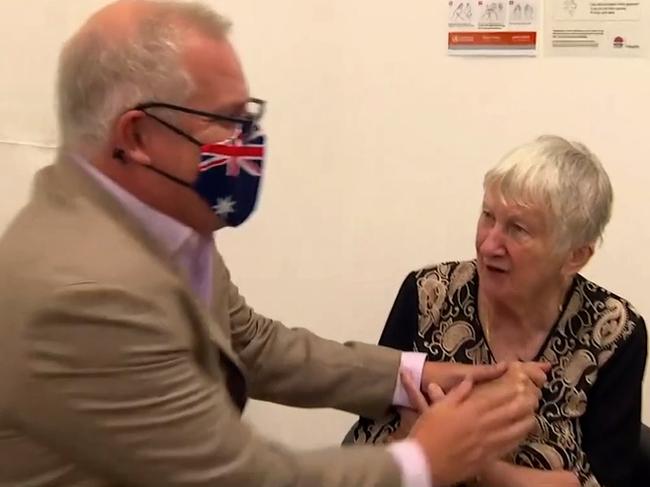 Prime Minister Scott Morrison with the first COVID-19 vaccine recipient Jane Milysiak.