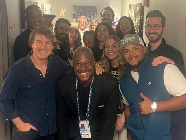 Former NFL player Derrick Brooks (front, centre) poses with Tom Cruise and his children Connor (front, right) and Isabella (third woman behind Brooks).