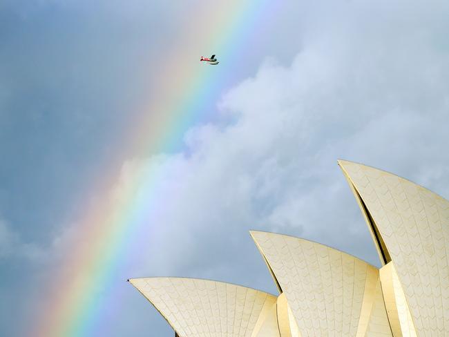 Hope she had her camera — this the couple’s ridiculously photogenic return to Rose Bay. Picture: Richard Dobson