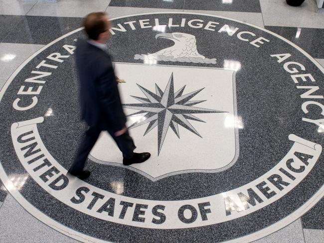 (FILES) This file photo taken on August 13, 2008 shows a man walking over the seal of the Central Intelligence Agency (CIA) in the lobby of CIA Headquarters in Langley, Virginia. The CIA can turn your TV into a listening device, bypass popular encryption apps, and possibly control your car, according to a trove of alleged documents from the US spy agency released on March 7, 2017 by WikiLeaks. The group posted nearly 9,000 documents it said were leaked from the Central Intelligence Agency, in what it described as the largest-ever publication of secret intelligence materials.  / AFP PHOTO / AFP FILES / SAUL LOEB