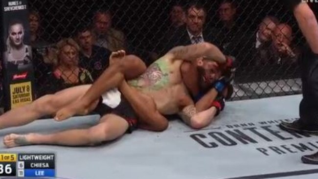 Kevin Lee has Michael Chiesa in a choke hold.