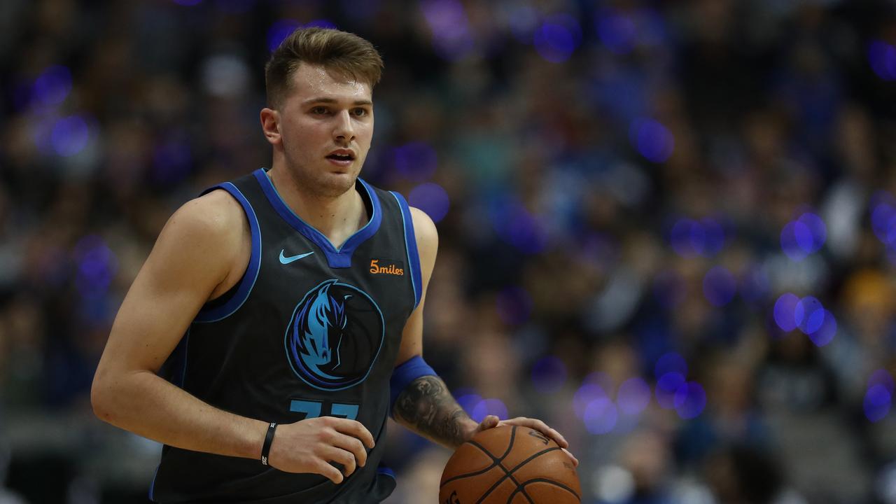 Dončić in his early years with the Mavericks. (Photo by RONALD MARTINEZ / GETTY IMAGES NORTH AMERICA / AFP)