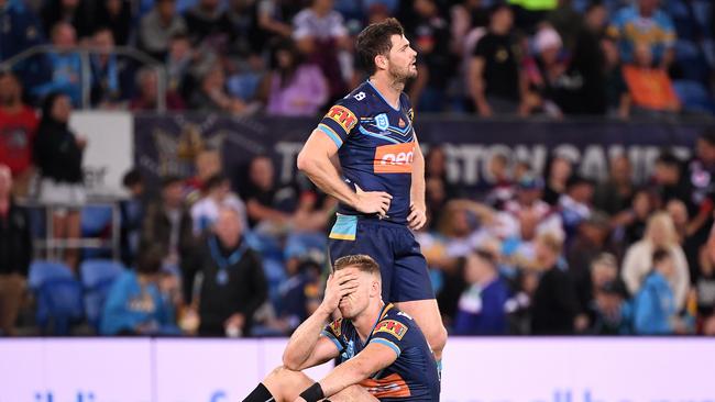 Bryce Cartwright and Anthony Don are dejected after the Titans’ Round 14 loss to New Zealand at Cbus Super Stadium. Picture: AAP Image