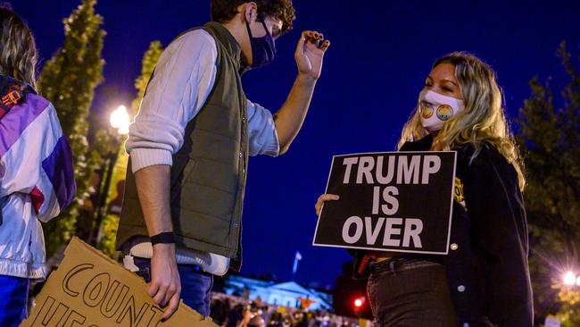 Young Democrats dance on Black Lives Matter Plaza outside the White House on Thursday. Picture: AFP