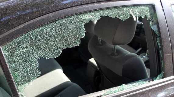 smashed car window for web. Police warning generic crime theft car