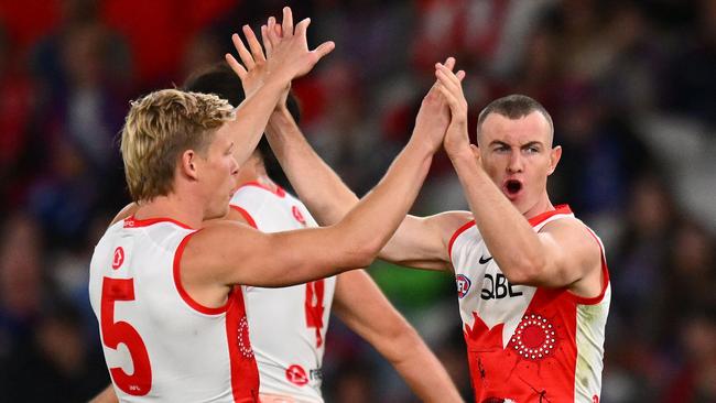 MELBOURNE, AUSTRALIA - MAY 23: Isaac Heeney and Chad Warner of the Swans celebrate a goal during the round 11 AFL match between Western Bulldogs and Sydney Swans at Marvel Stadium, on May 23, 2024, in Melbourne, Australia. (Photo by Morgan Hancock/Getty Images)