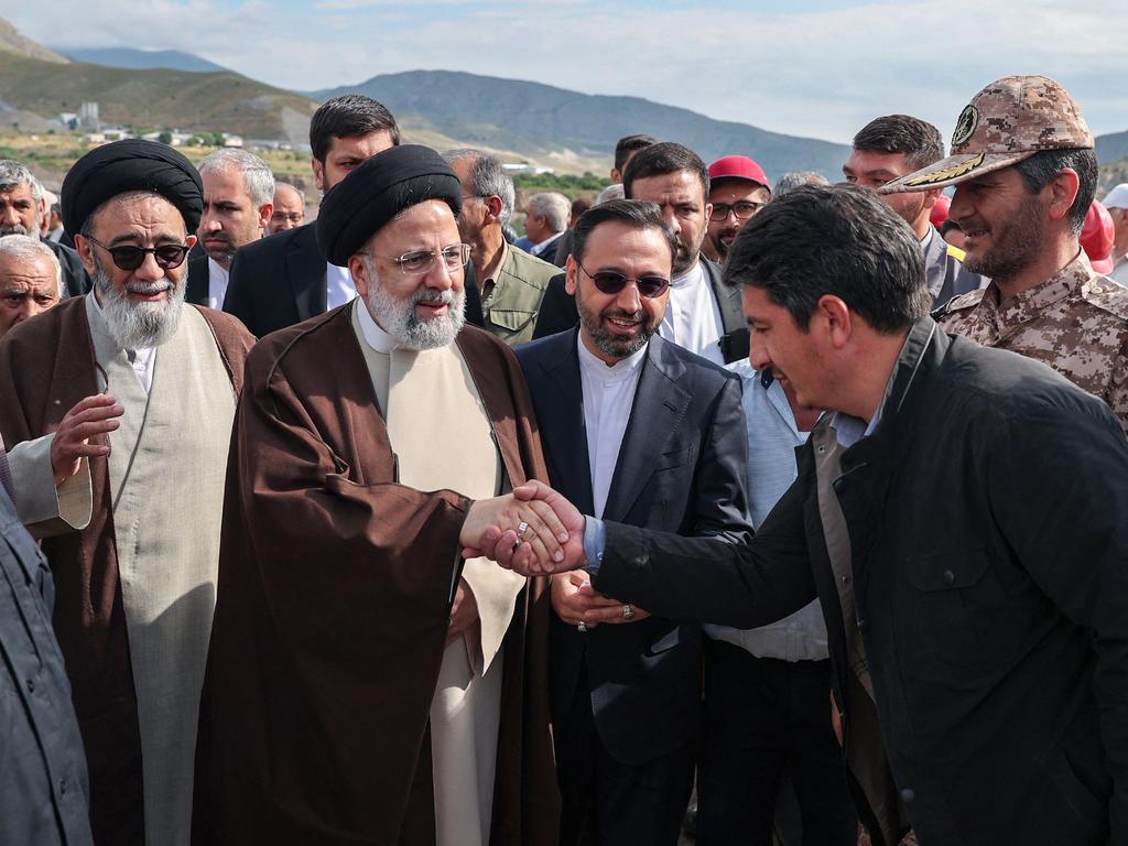 Iran's President Ebrahim Raisi (2nd L) with members of his delegation in Aras, ahead of the inauguration ceremony for a dam project on the border between the two countries. Picture: AFP