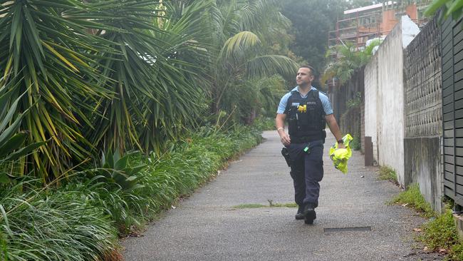 A police officer investigating the hit-and-run death at Freshwater. Picture: Jeremy Piper