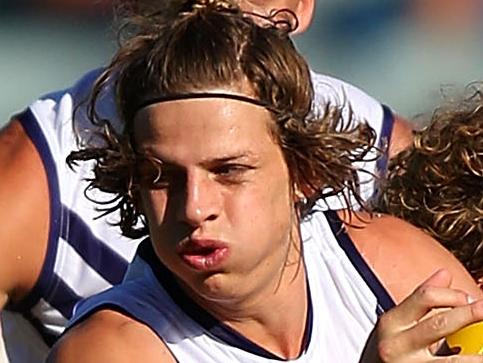 PERTH, AUSTRALIA - MARCH 22: Nathan Fyfe of the Dockers looks to break from a tackle by Matt Priddis of the Eagles during the NAB Challenge AFL match between the West Coast Eagles and the Fremantle Dockers at Domain Stadium on March 22, 2015 in Perth, Australia. (Photo by Paul Kane/Getty Images)