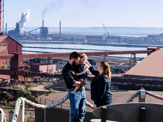 Tom Wilson, 3-year-old Charlotte and Alicia Wilson overlooking the steelworks in Whyalla, Friday, March 12, 2021. (The Australian, Morgan Sette)