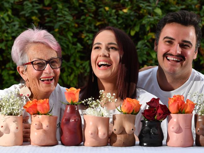 Dorothy Davie, Jessica Mason and Daniel Capogreco pose for a photograph in the North Adelaide, Adelaide on Wednesday the 31st of July 2019. Founder of Dots Pots, Jessica Mason uses her unique form of pottery shaped like boobs to raise money and awareness for places like Women's Safety Services and the Hutt St Centre. (AAP Image/Keryn Stevens)