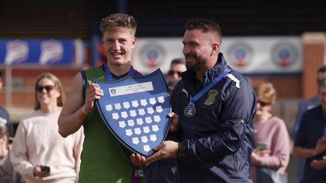 Zak Johnson of Parade College with coach Ricky Dyson after winning the Herald Sun Shield Senior Boys Div 1 Grand Final. Picture: Daniel Pockett/AFL Photos/via Getty Images