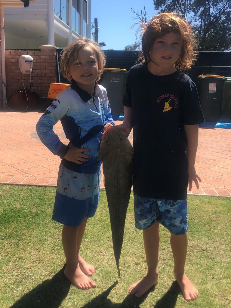 Brothers Apollo and Magnus Howell were over the moon when this big flathead was caught off their local beach at Marcoola using small pilchards.