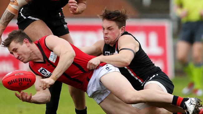 VFL 2016  Round 14 Frankston v Essendon. James Polkinghorne in action for Essendon against Frankston's Jordan Pollard. Picture: Mark Stewart