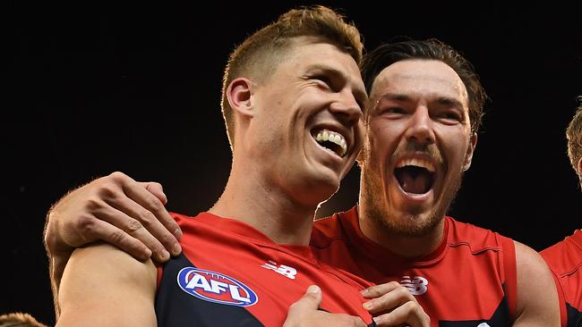 Jake Melksham and Michael Hibberd celebrate after Melbourne’s finals win over Hawthorn. Picture: AAP Images