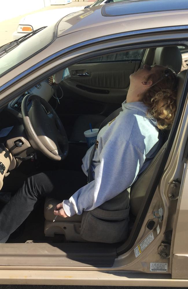 Erika Hurt sits with her baby son crying in the back seat of the car in Hope, Indiana. Picture: Town of Hope Police Department via AP