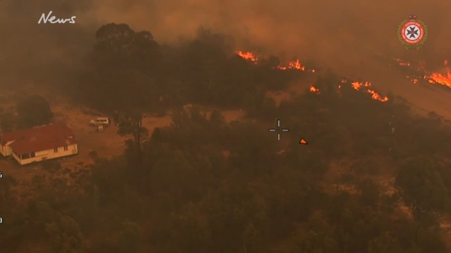 Crews battle to defend homes as Tara fire rages