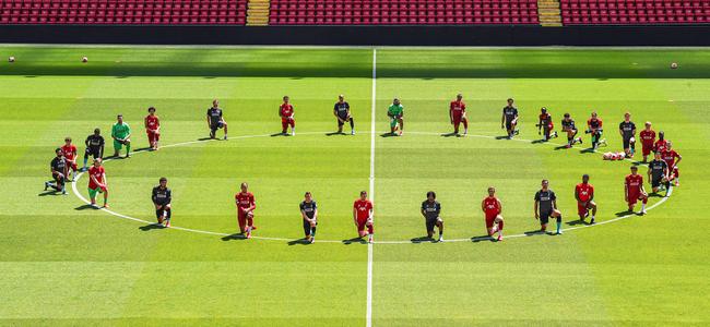 Liverpool players take a knee at Anfield in memory of George Floyd. Picture: Getty