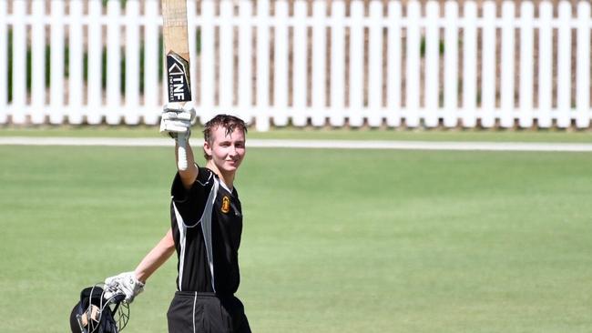 Port Adelaide’s Austin Umpherston raises his bat after reaching 100 in the grand final.