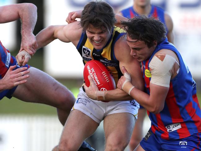 Nathan Freeman of Sandy is tacked by Toby Pinwill and Dylan Viojo-Rainbow of Port during the VFL match between Port Melbourne and Sandringham played at North Port Oval on Saturday 15th July, 2017. Picture: Mark Dadswell