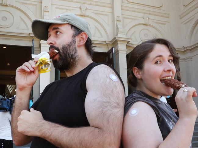 Ice-creams are handed out to people after receiving their vaccinations at the Royal Exhibition Building in Carlton on Saturday. Picture: NCA NewsWire / David Crosling