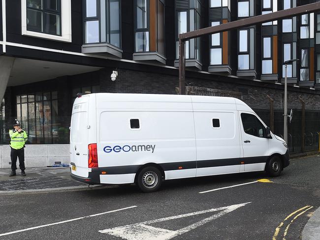 A prison van goes past police officers standing guard outside Liverpool Magistrates' Court in Liverpool. Picture: AFP