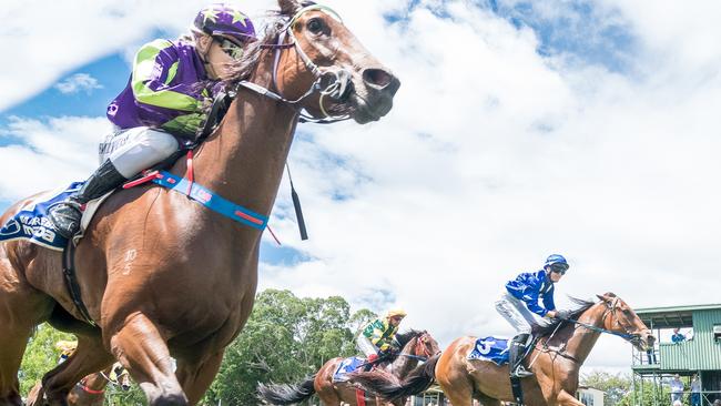 Trainer Scott Cooper and jockey Emily Cass win a race at Mareeba. Picture: Peter Roy.