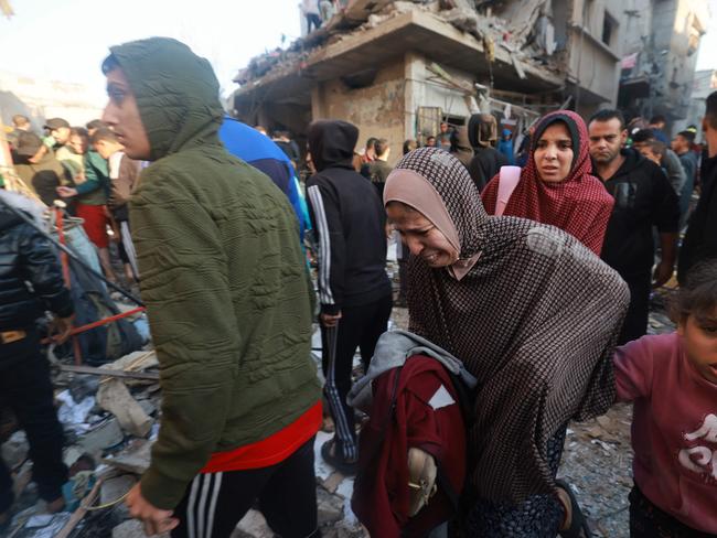 Palestinians rush out of a bombarded area in the southern Gaza Strip. Picture: AFP