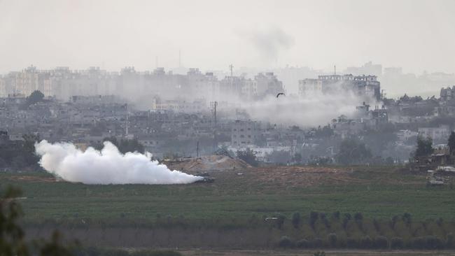 Israeli armoured vehicles take up positions in the north of the Gaza Strip on Sunday. Picture: AFP